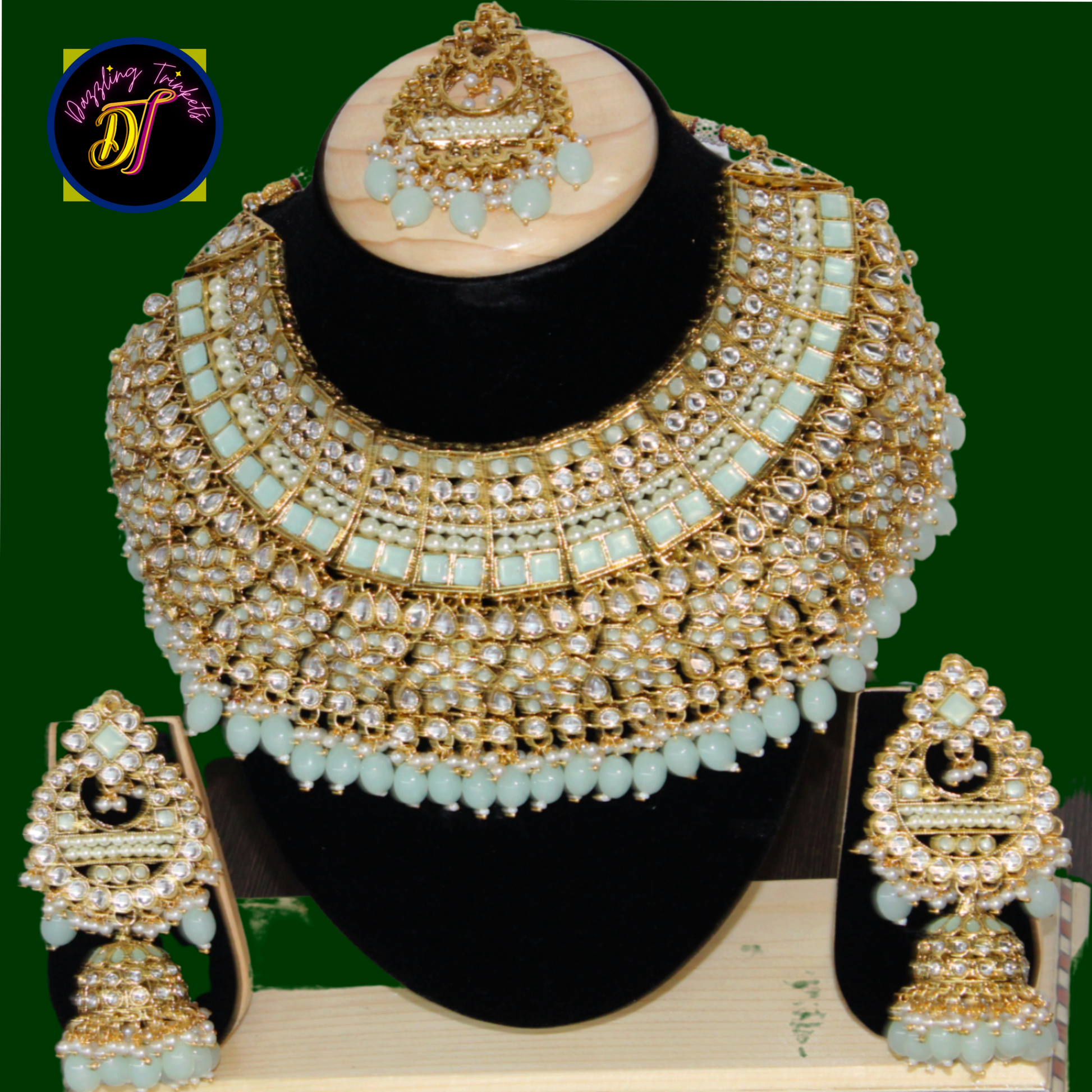 The image showcases the luxurious design and intricate detailing of the Kundan Chokar Necklace Set, available on www.dazzlingtrinkets.com. It exudes a sense of opulence and sophistication, perfect for special occasions or formal events.